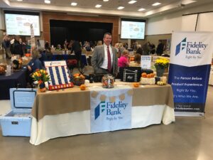 Fidelity Bank table and employee at a convention for small businesses