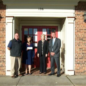 Fidelity team posing outside a bank