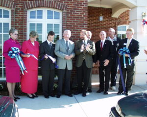 A group of people in business wear smile at the camera