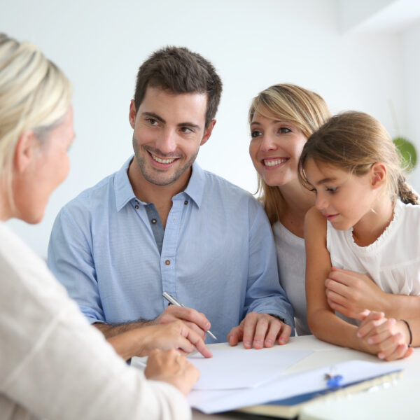 A family meeting with an agent to talk about paperwork