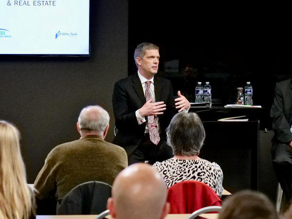 A man presenting to an audience