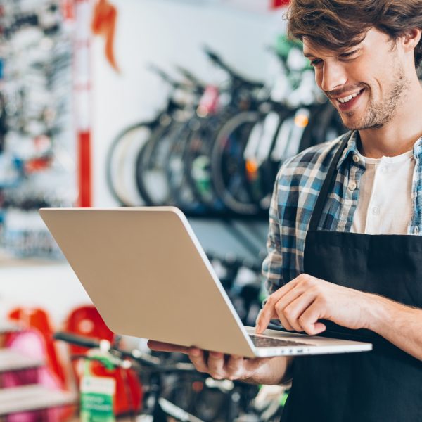 Bike shop owner with laptop