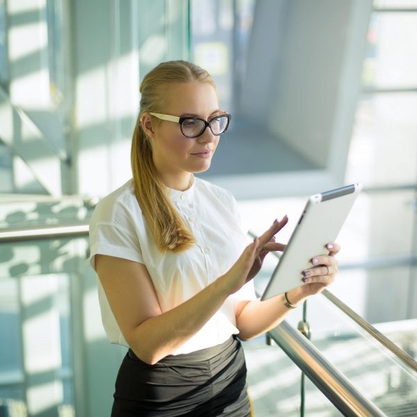 Woman intelligent government worker using applications via touch pad