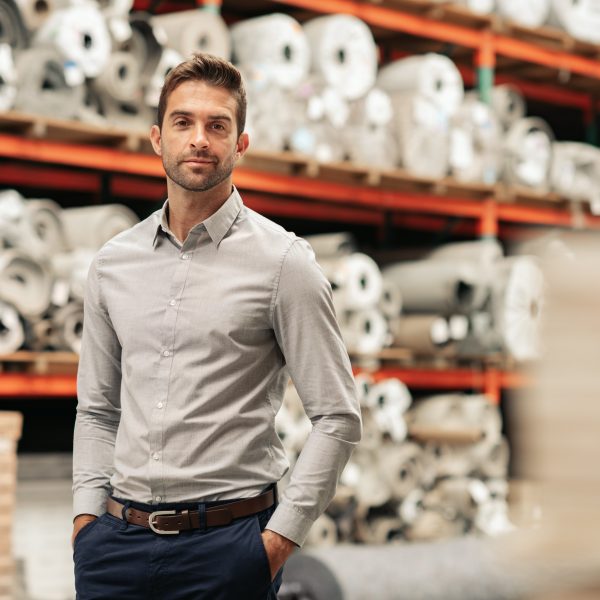 Portrait Of A Manager Standing With His Hands In His Pockets