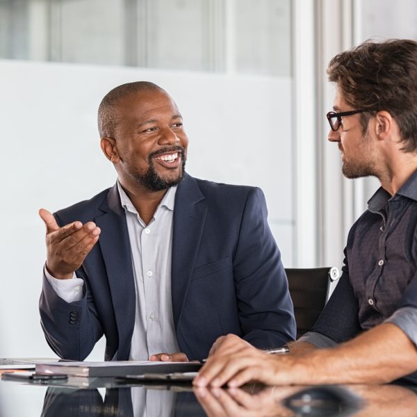 Man talking to another man in business environment