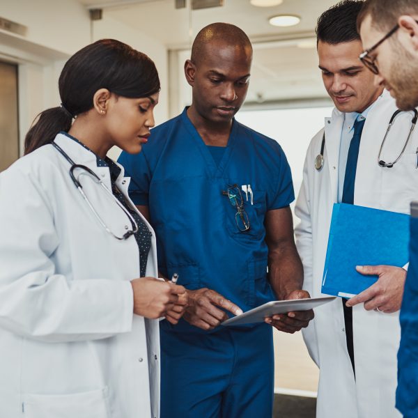 Multiracial team of doctors discussing a patient