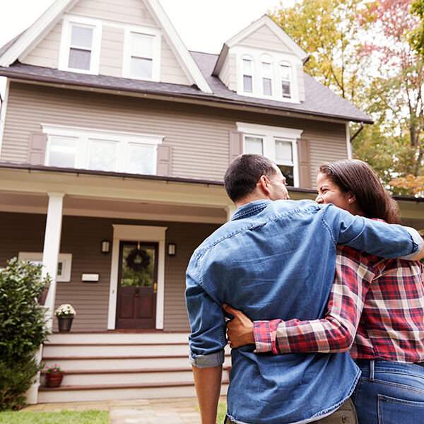 Couple Walking Towards New House