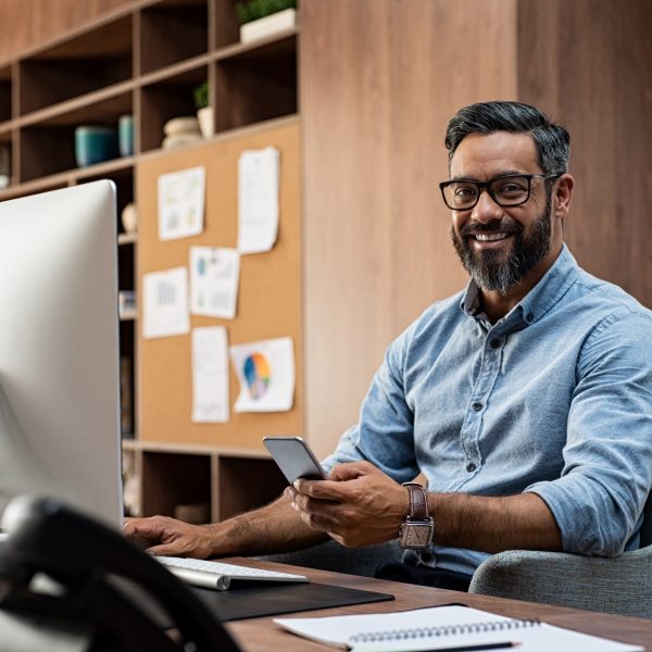 Smiling,Business,Man,Wearing,Eyeglasses,Working,On,Desktop,Computer