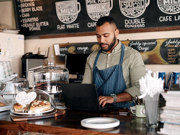 Coffee shop owner working on the computer