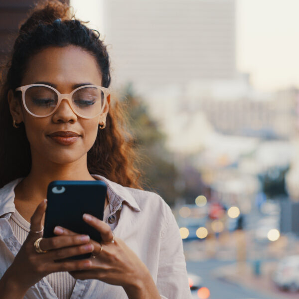 African American woman looking at cell phone