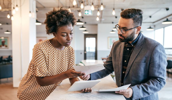 Man and Woman looking over papers