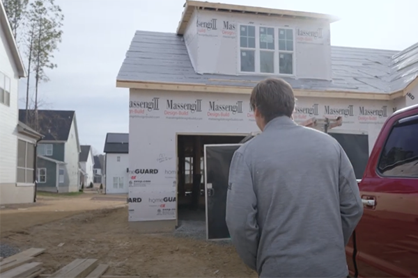 Blake Massengill inspecting a house being built.